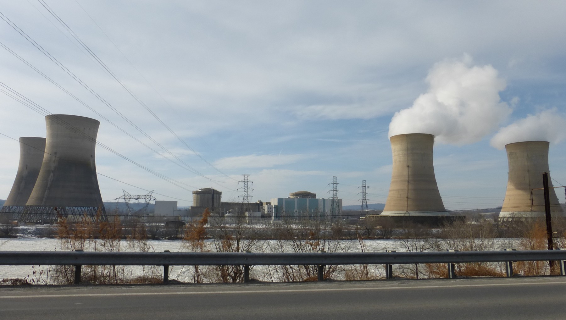 Cooling towers and facilities at Three Mile Island in a 2014 photograph