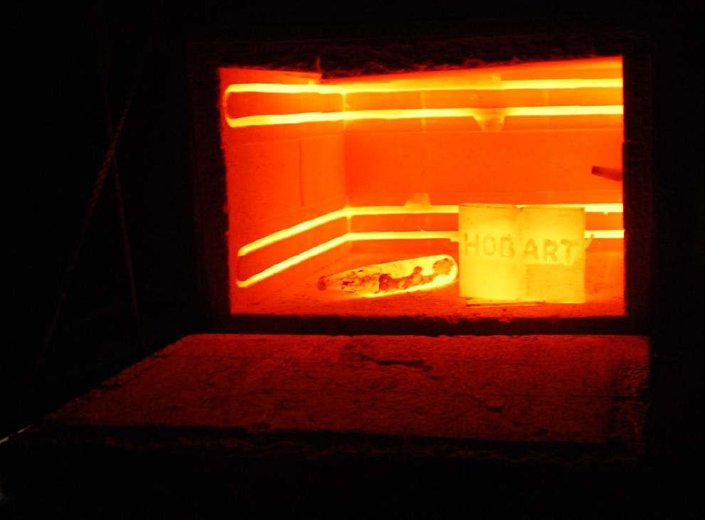 Glowing components inside a heat-treatment furnace.